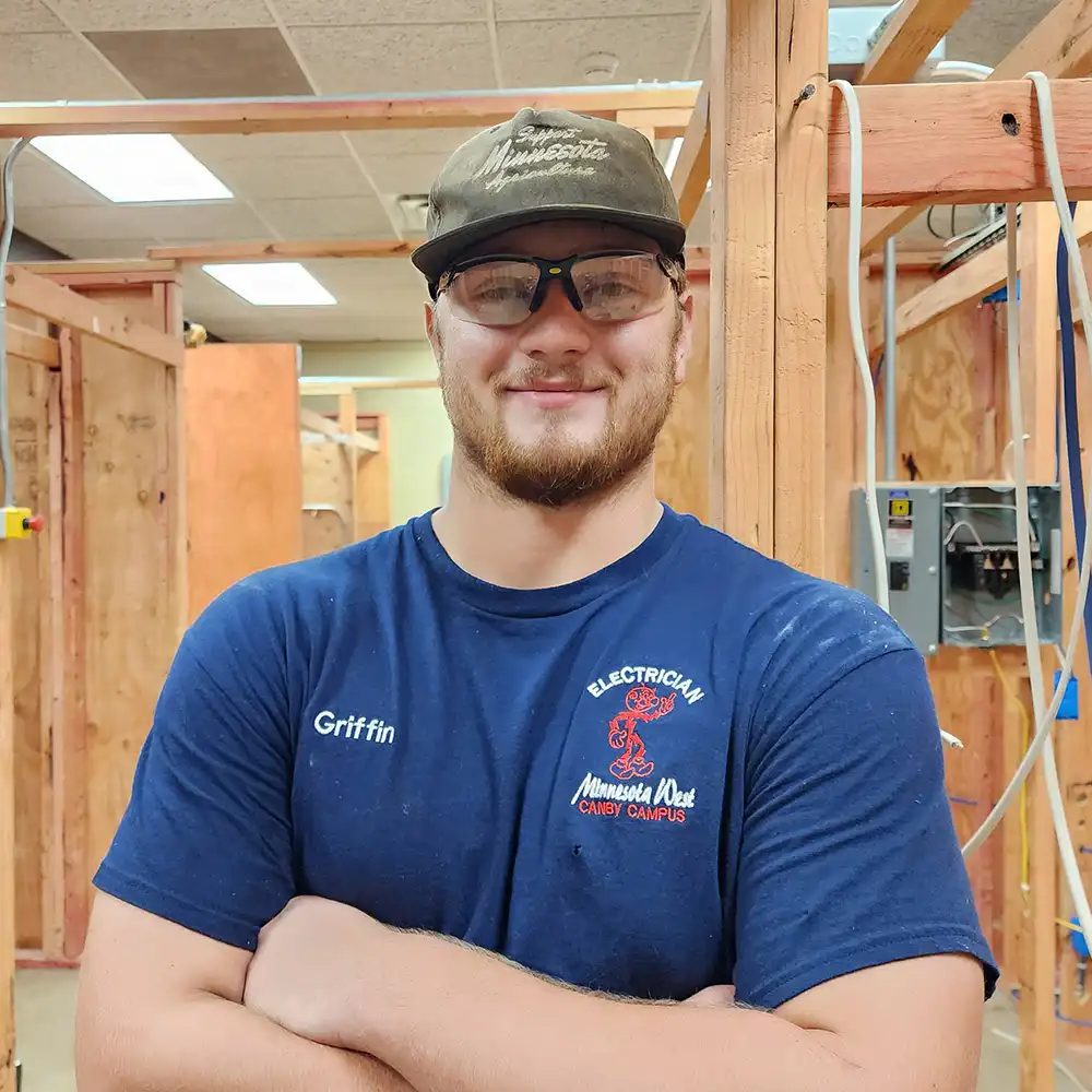 Griffin Evans smiling at the camera in the electrician program